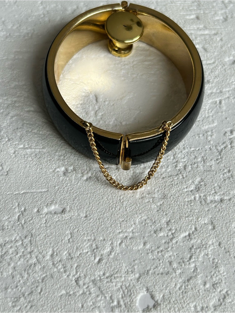 Gold-Tone Black Enamel Cuff Bracelet with Safety Chain